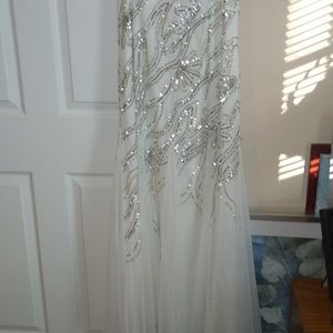 White sequent top with flowing bottom gown